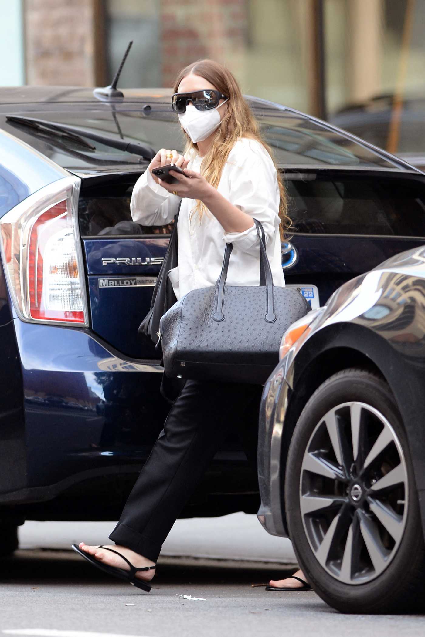 Mary-Kate Olsen in a White Shirt Leaves Her Bussiness Office in New York 06/25/2021