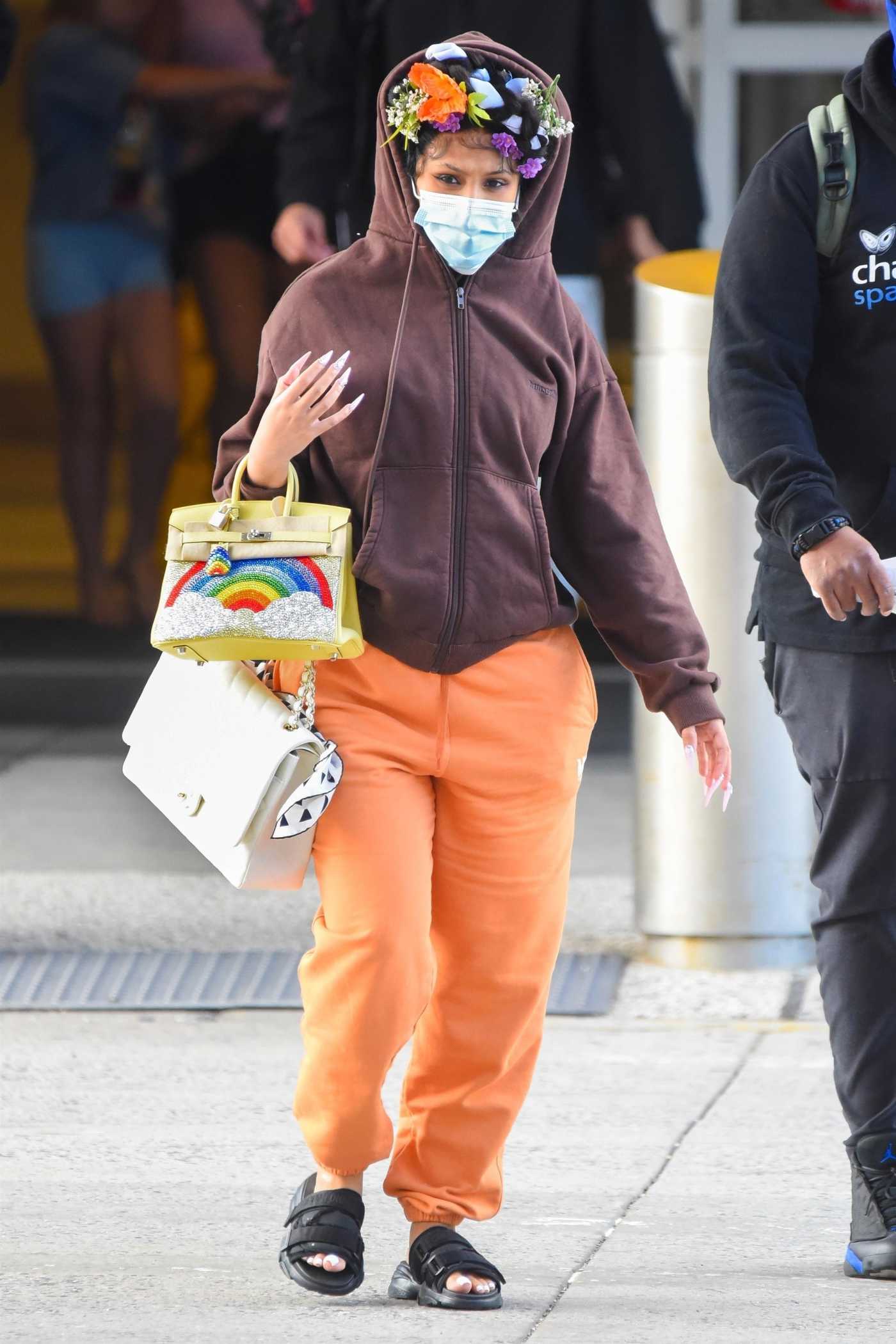 Cardi B in an Orange Sweatpants Arrives at JFK Airport in New York 07/09/2021