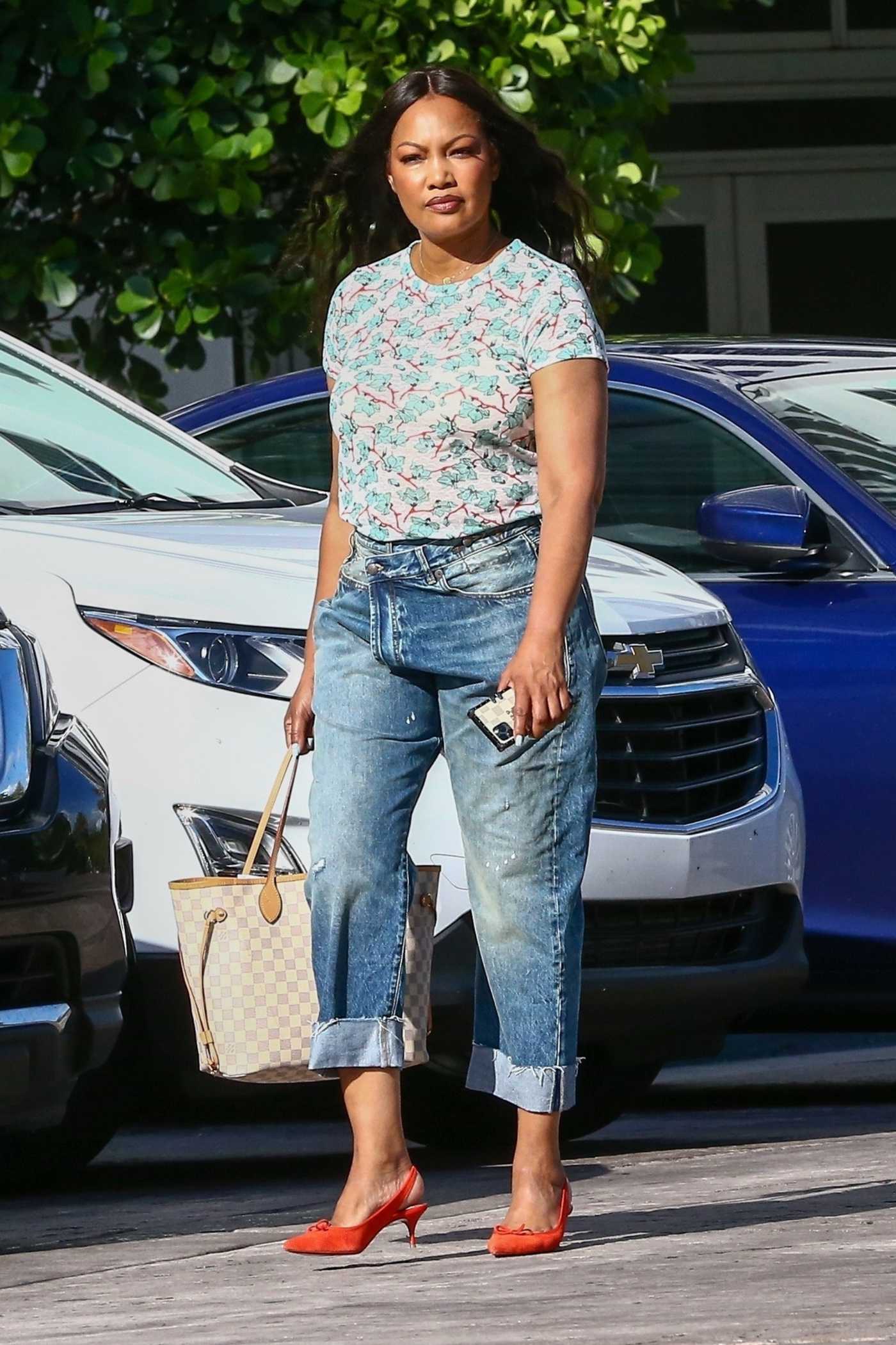 Garcelle Beauvais in a Floral Tee Leaves Her Hotel in Miami 07/16/2021