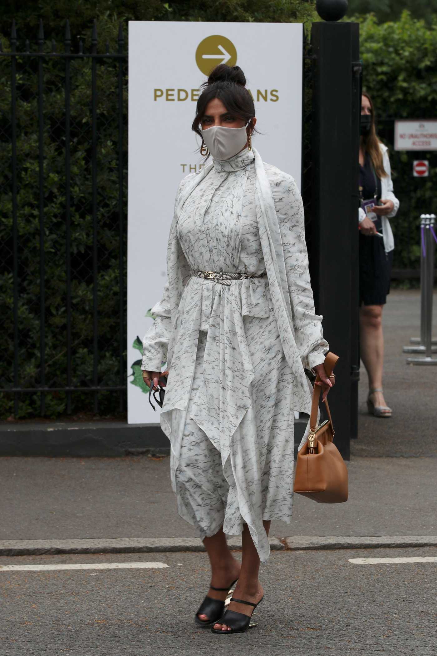 Priyanka Chopra in a Protective Mask Arrives at Wimbledon for the Women's Final in London 07/10/2021