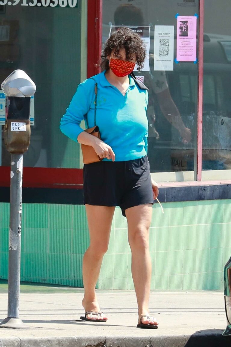 Alia Shawkat in a Red Protective Mask