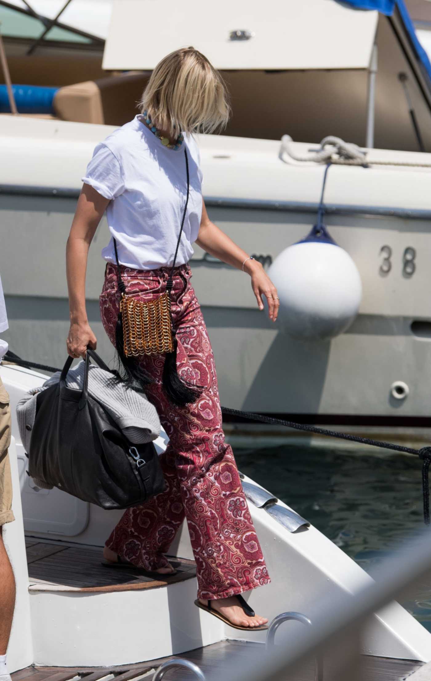Karolina Kurkova in a White Tee Arrives in Capri, Italy 07/30/2021