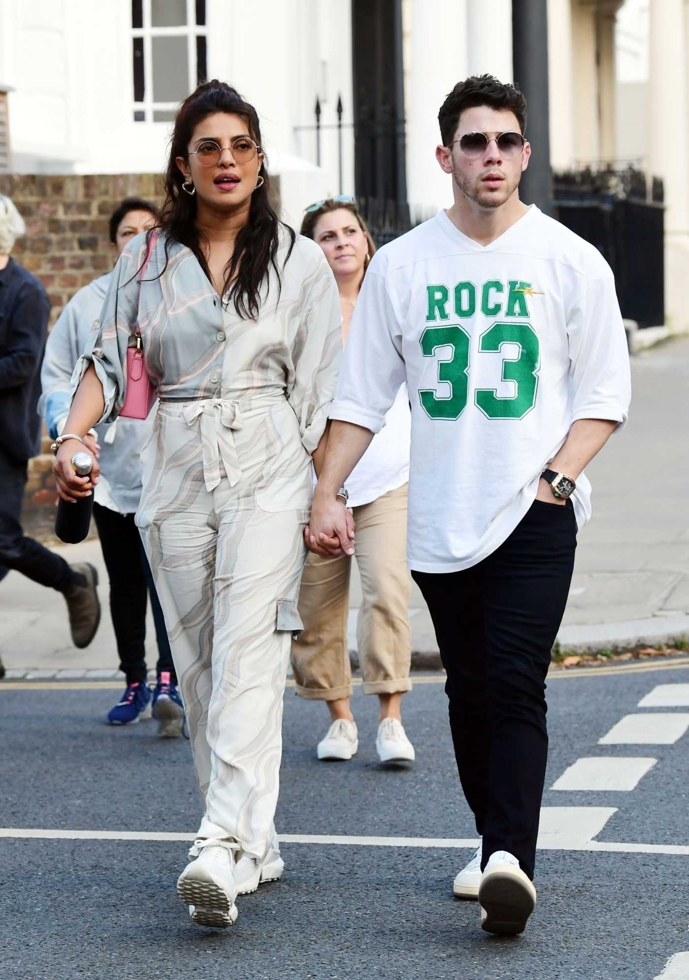 Nick Jonas in a White Long Sleeves T-Shirt Was Seen Out with Priyanka Chopra in London 08/13/2021