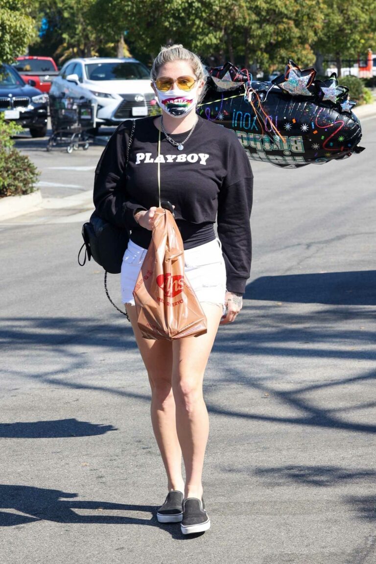 Kesha in a White Denim Shorts