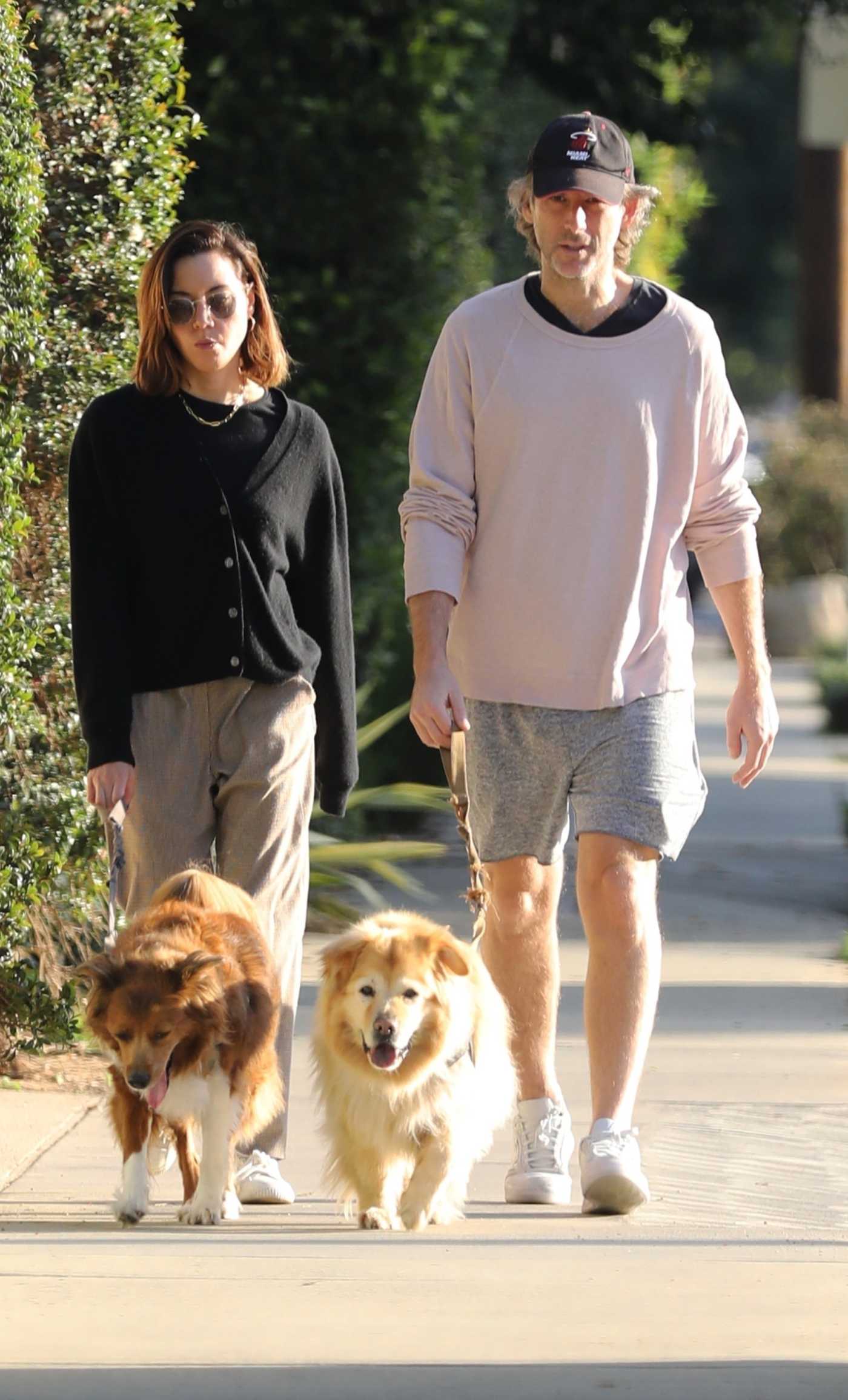 Aubrey Plaza in a Black Cardigan Takes Her Dogs for a Walk Out with Jeff Baena in Los Feliz 10/22/2021