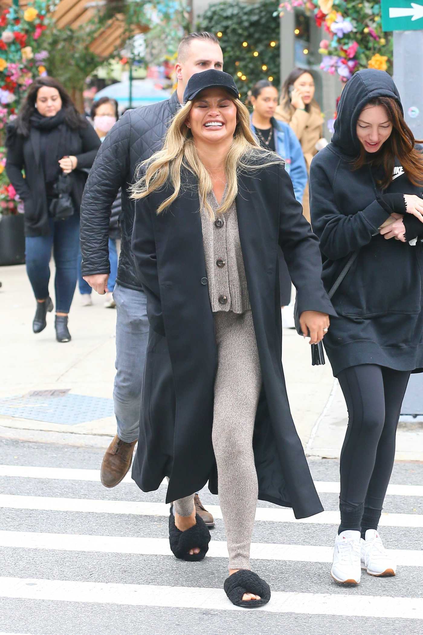Chrissy Teigen in a Black Cap Was Seen Out with a Friends in New York City 10/26/2021