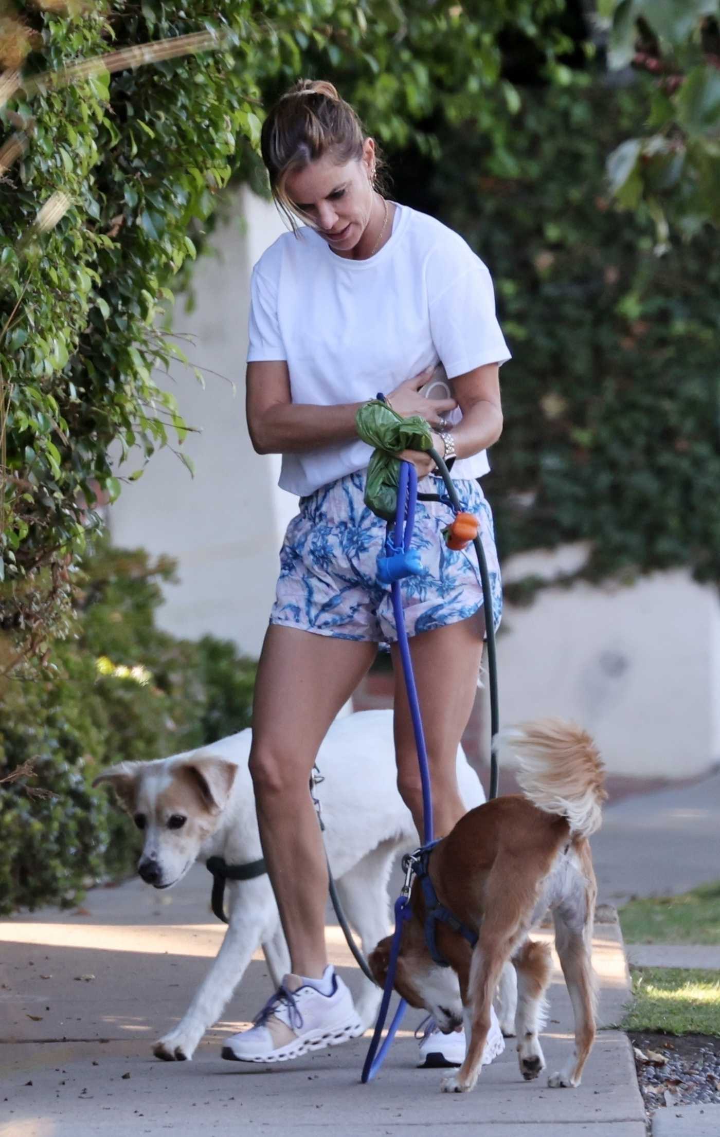 Natalie Morales in a White Tee Walks Her Dogs in Brentwood 10/02/2021