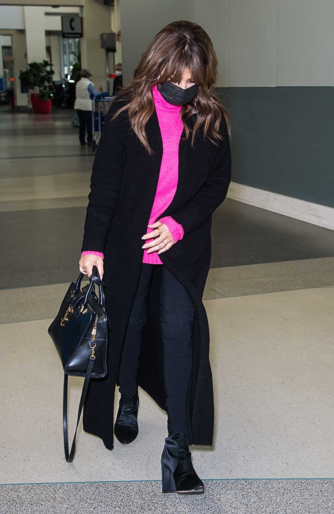 Paula Abdul in a Black Coat Arrives at at Philadelphia International Airport in Philadelphia 10/25/2021