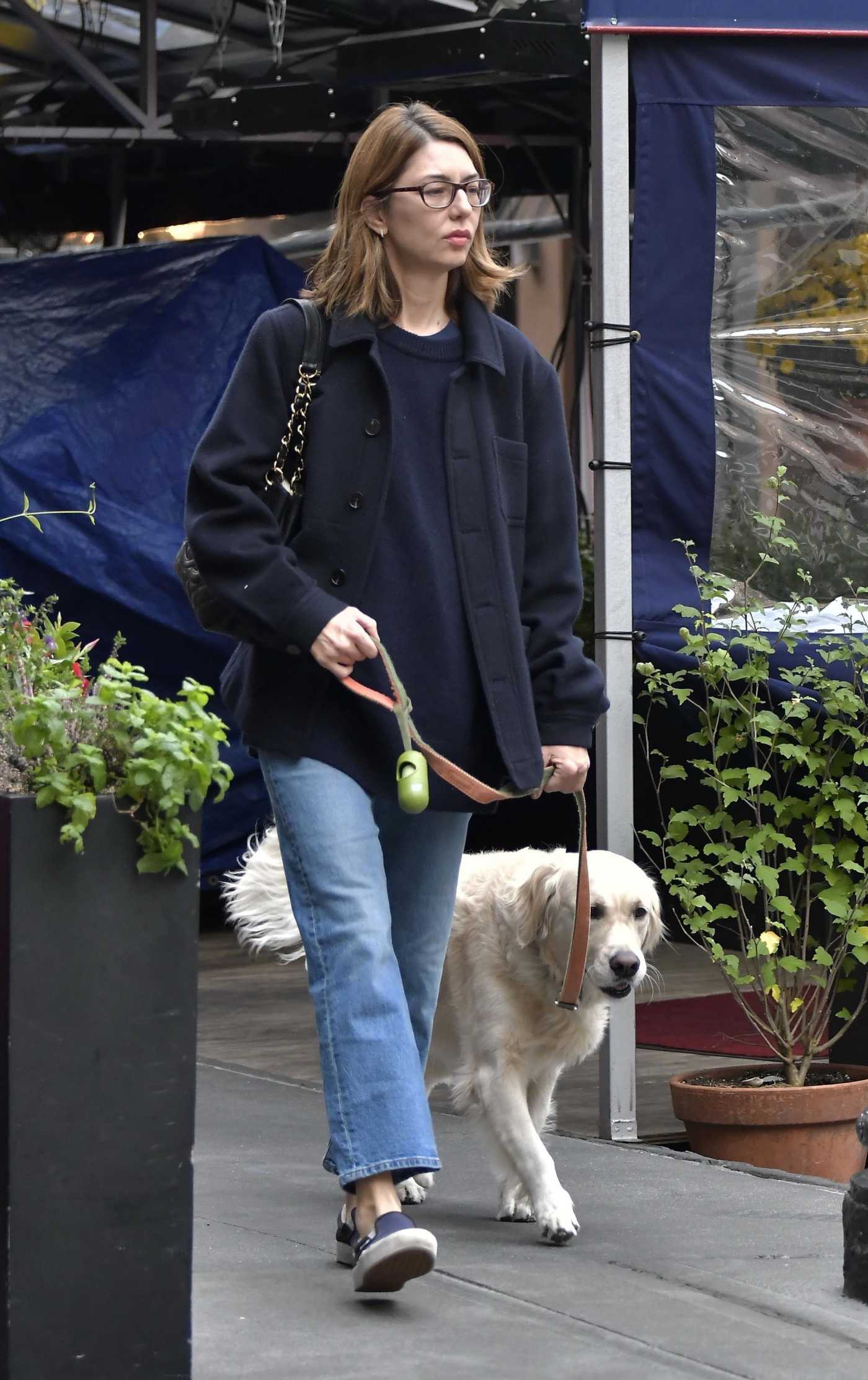 Sofia Coppola in a Blue Jeans Walks Her Dog in the West Village in New York 10/20/2021