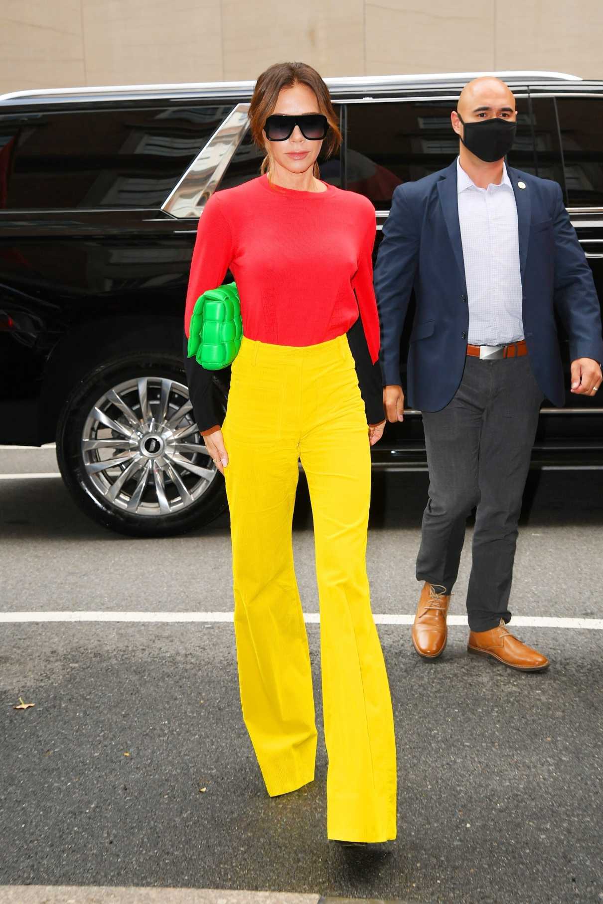 Victoria Beckham in a Yellow Pants Arrives on Good Morning America in New York City 10/12/2021