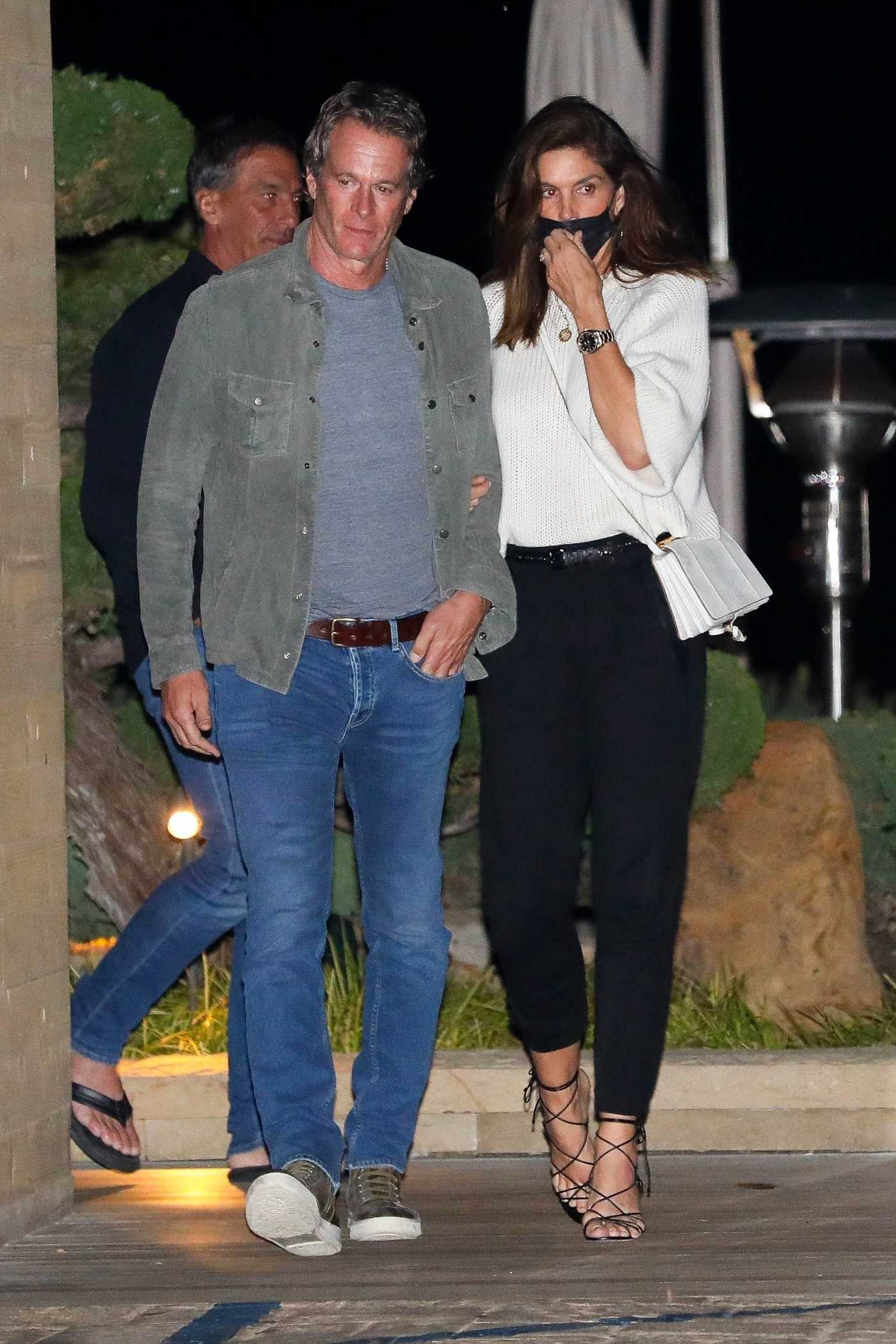 Cindy Crawford in a Black Protective Mask Leaving Dinner at Nobu with Hubby Randy Gerber in Malibu 11/22/2021