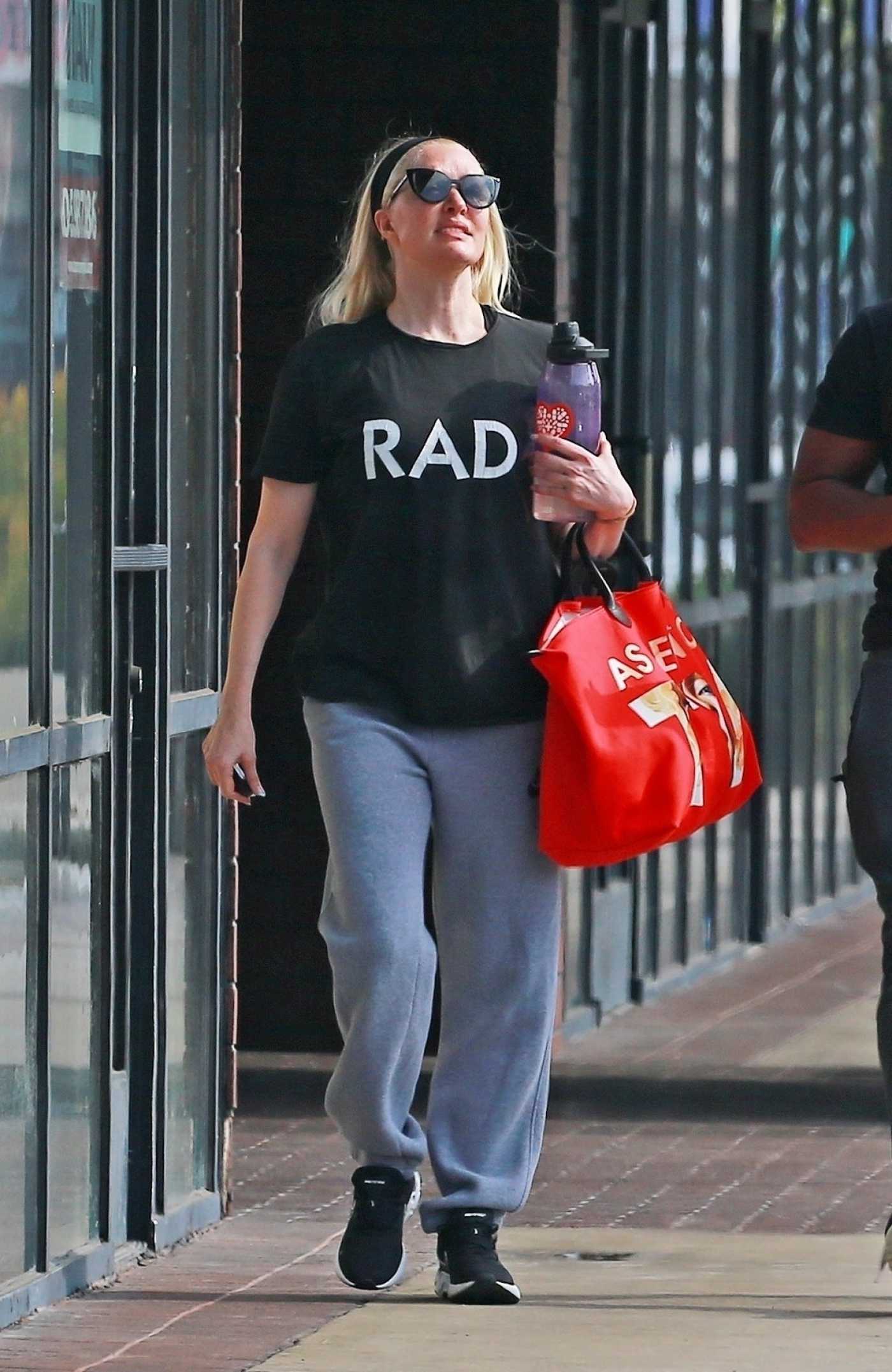 Erika Jayne in a Black Tee Leaves a Dojo with Her Trainer Following a Workout in West Hollywood 11/16/2021