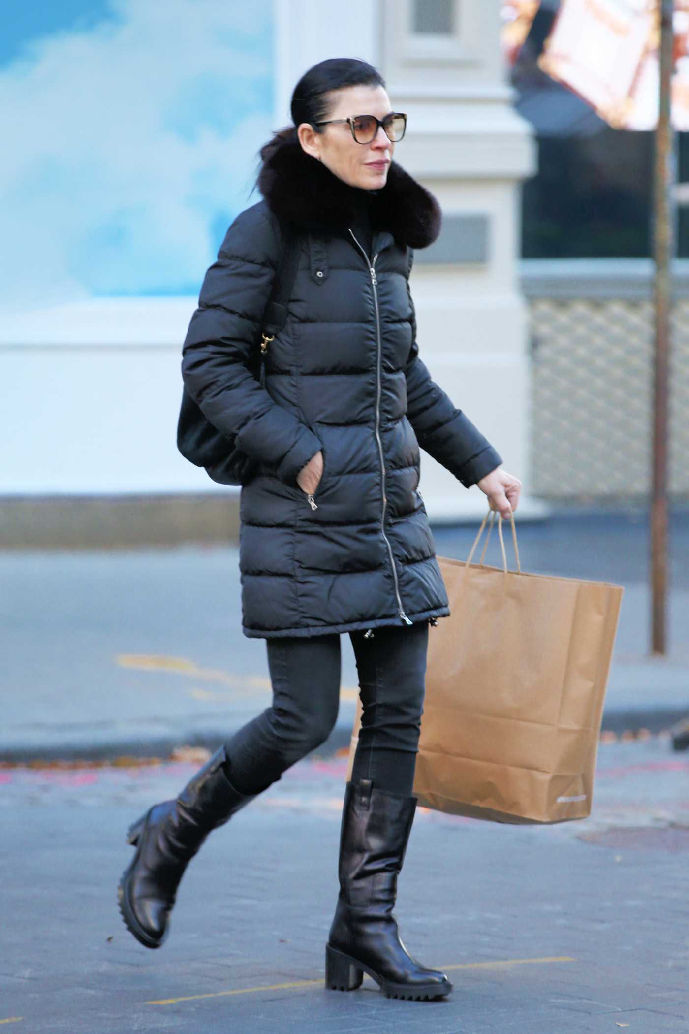 Julianna Margulies in a Black Puffer Jacket Was Seen Out in Soho in New York 11/12/2021