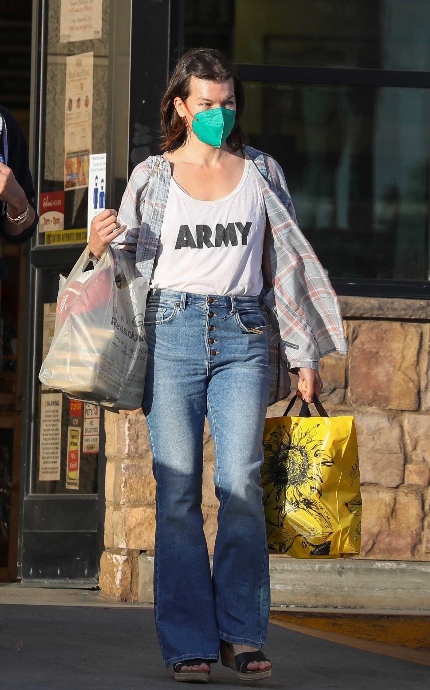 Milla Jovovich in a Green Protective Mask Goes Grocery Shopping with Her Husband Protective Mask in Los Feliz 11/22/2021