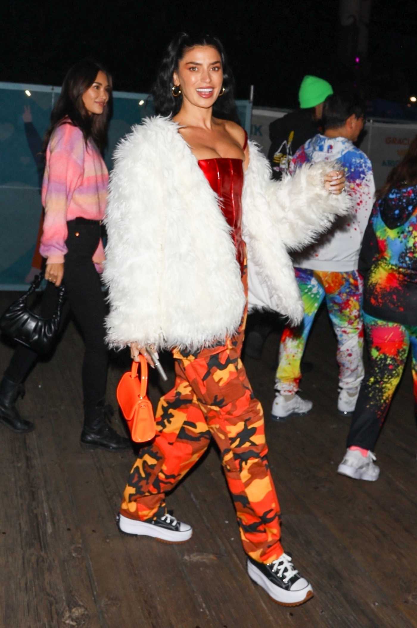 Nicole Williams in an Orange Camo Pants Arrives for Paris Hilton and Carter Reum’s Wedding After-Party at the Santa Monica Pier in Santa Monica 11/12/2021