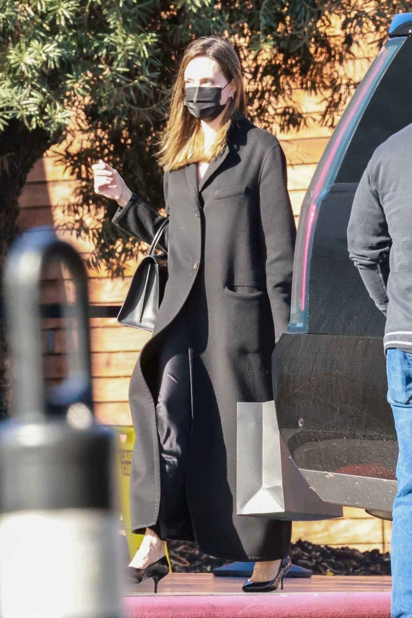 Angelina Jolie in a Black Coat Does a Christmas Eve Shopping in West Hollywood 12/24/2021