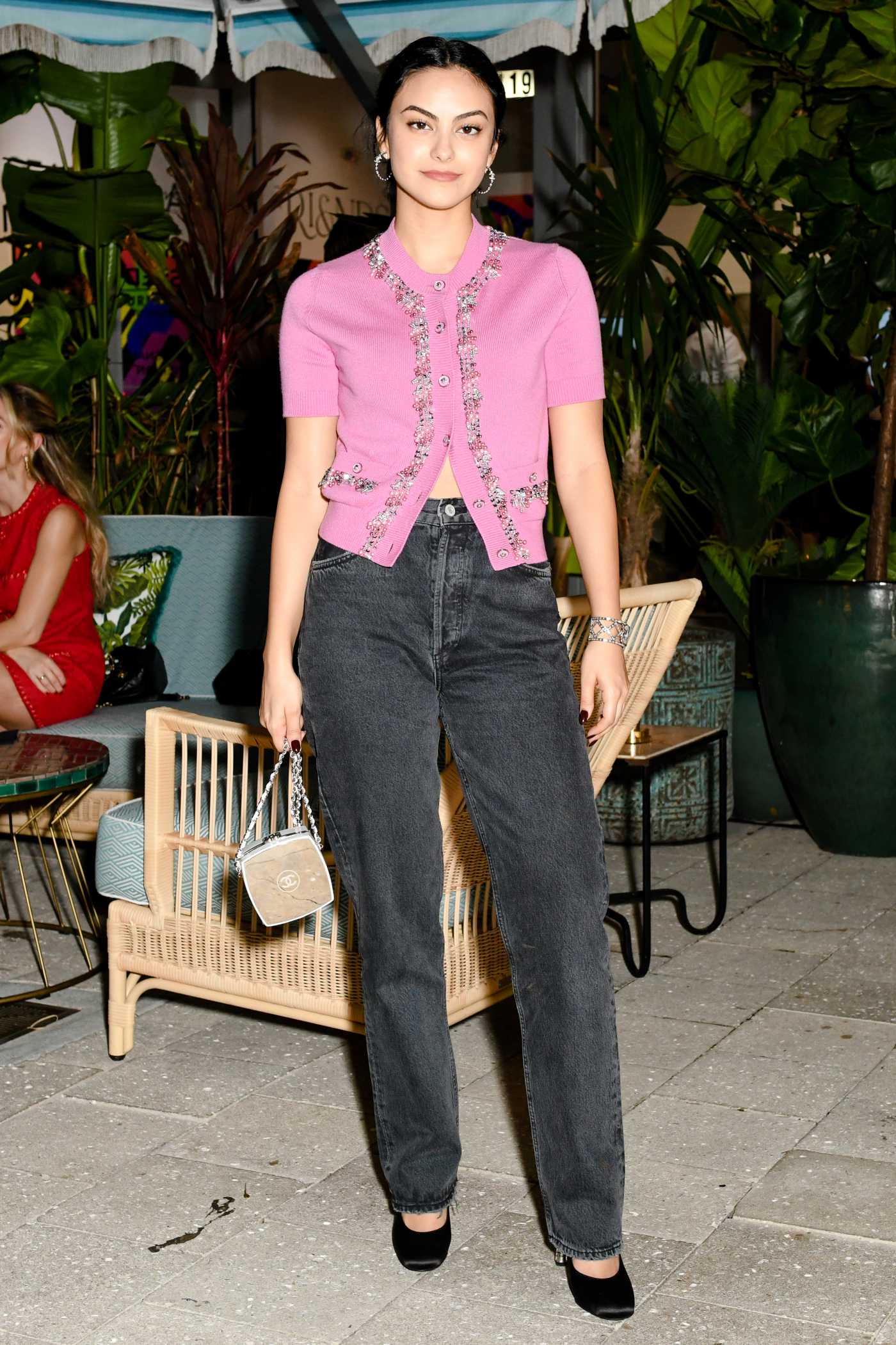 Camila Mendes in a Pink Blouse Attends the Chanel Cocktail Party to Celebrate the Opening of the New Boutique in Miami 12/02/2021