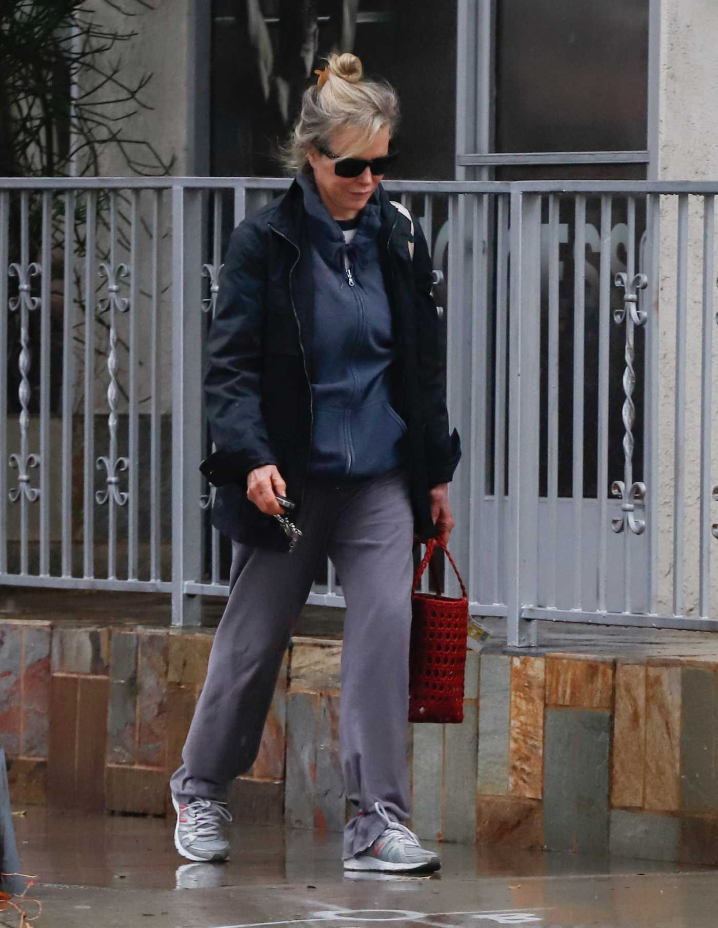Kim Basinger in a Black Jacket Was Seen Out in Rainy Los Angeles 12/23/2021