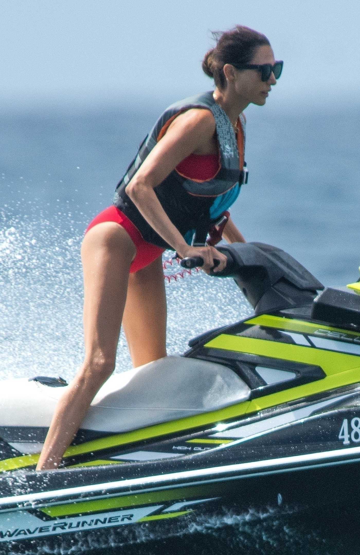 Lauren Silverman in a Red Bikini Glides Through the Waves in Barbados 12/24/2021