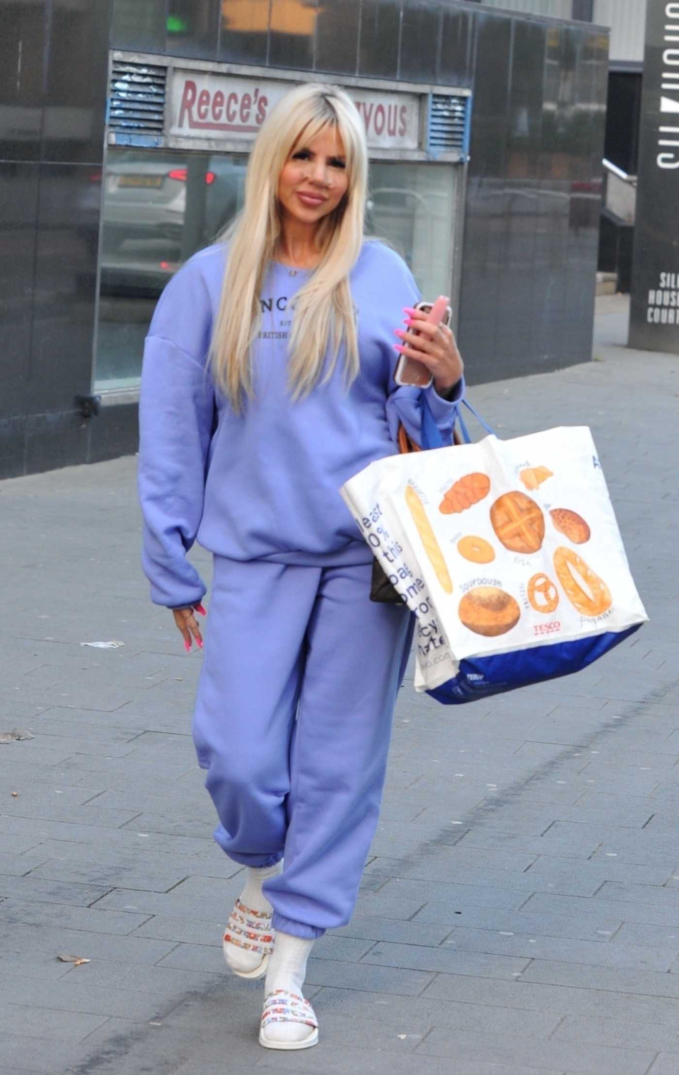 Hannah Elizabeth in a Purple Sweatsuit Was Seen with Bandaged Up Nose After Recent Nose Cosmetic Surgery in Liverpool 01/20/2022