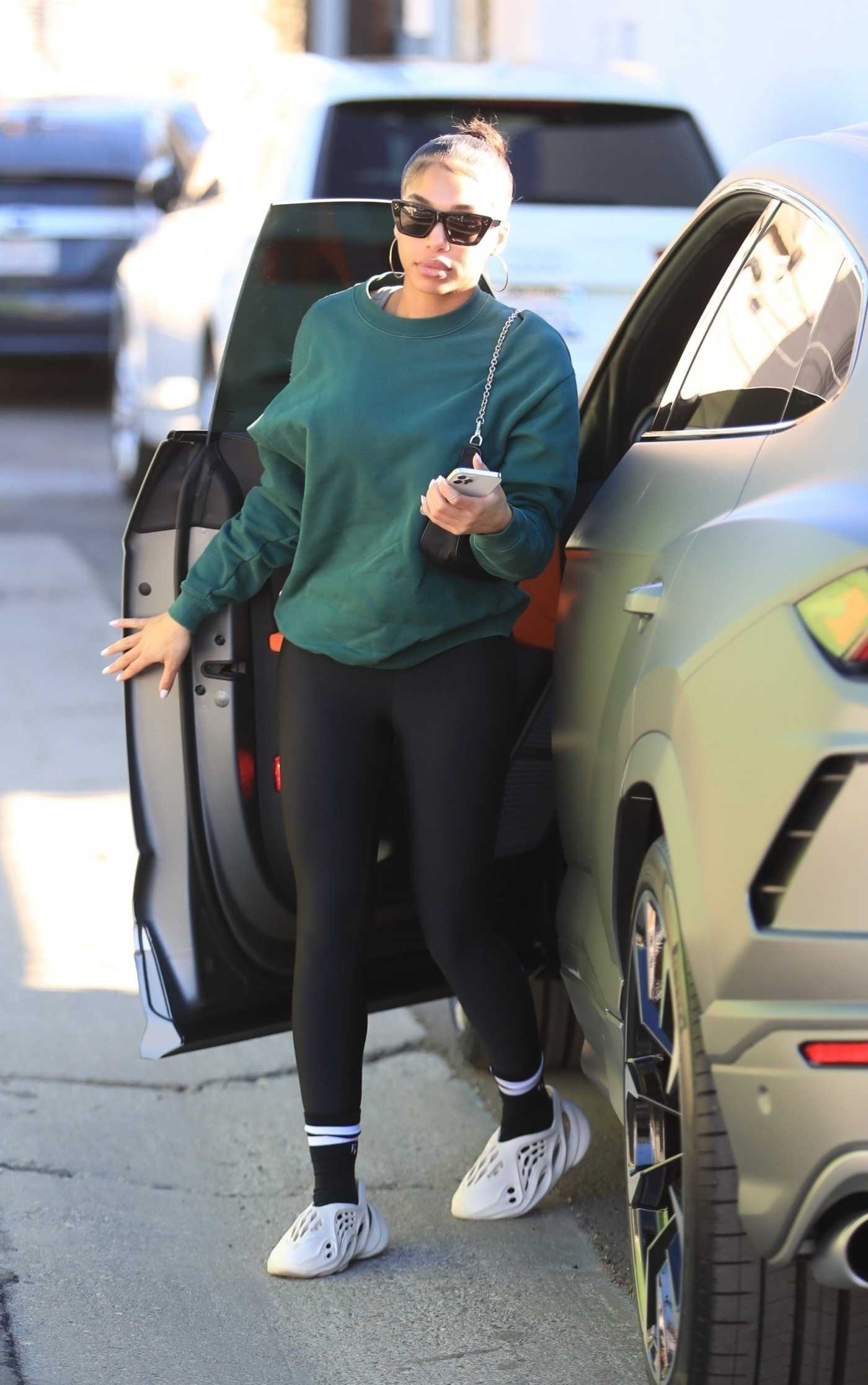 Lori Harvey in a Green Sweatshirt Arrives at Her Morning Workout in West Hollywood 01/11/2022
