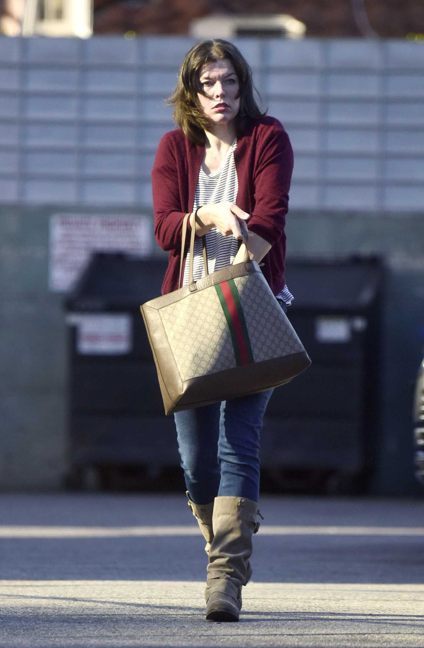 Milla Jovovich in a Striped Tee Was Seen Out in Los Angeles 01/12/2022