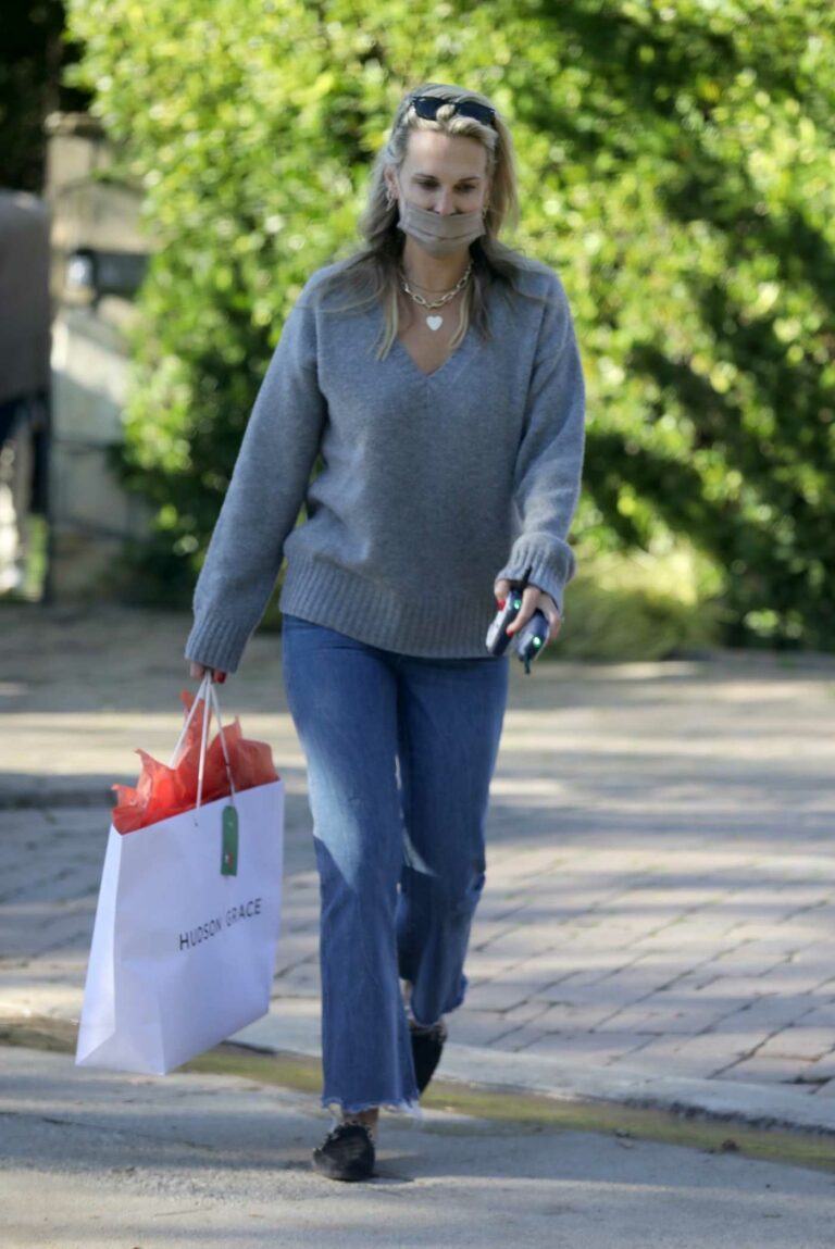 Molly Sims in a Grey Sweater
