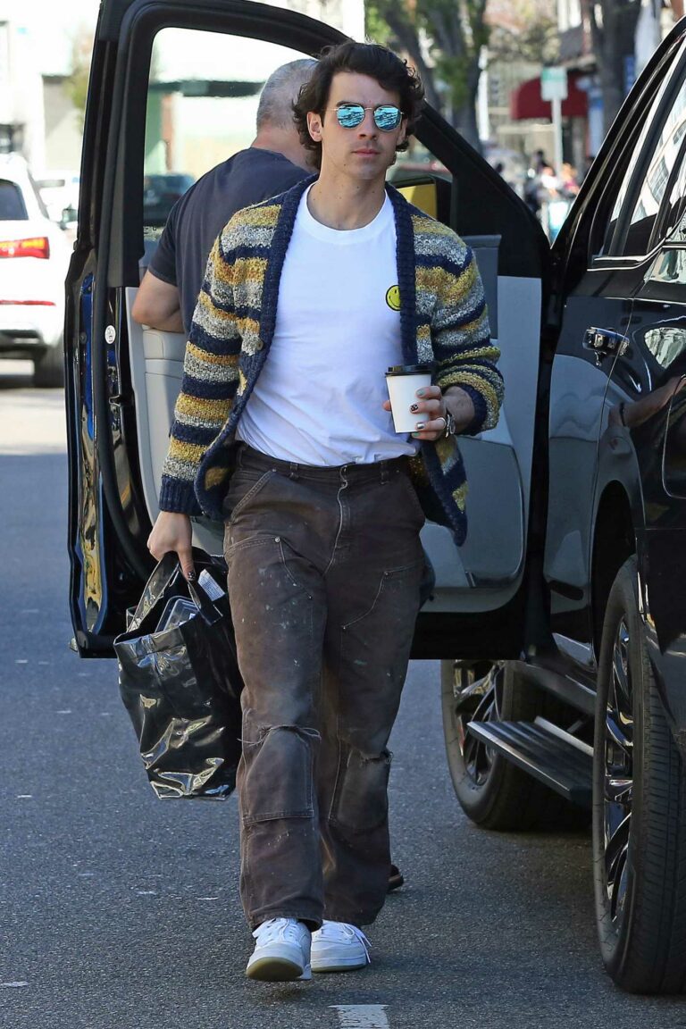 Joe Jonas in a Striped Cardigan