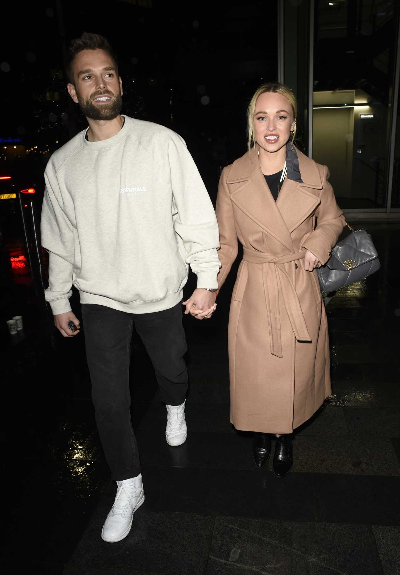 Jorgie Porter in a Beige Coat Enjoys a Date Night at The Ivy Restaurant in Manchester 02/13/2022