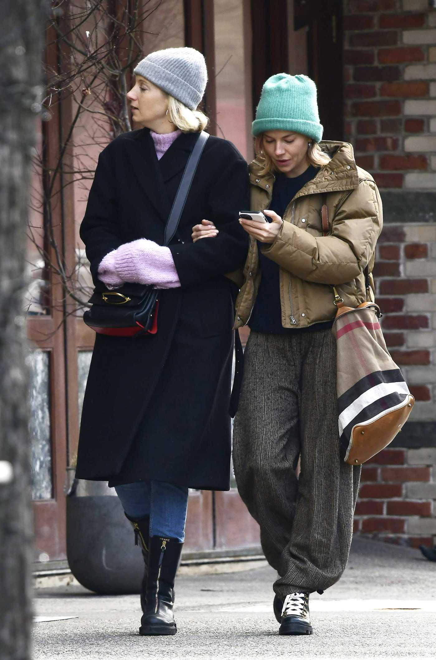 Sienna Miller in a Green Beanie Hat Was Seen Out with Savannah Miller in New York 02/06/2022