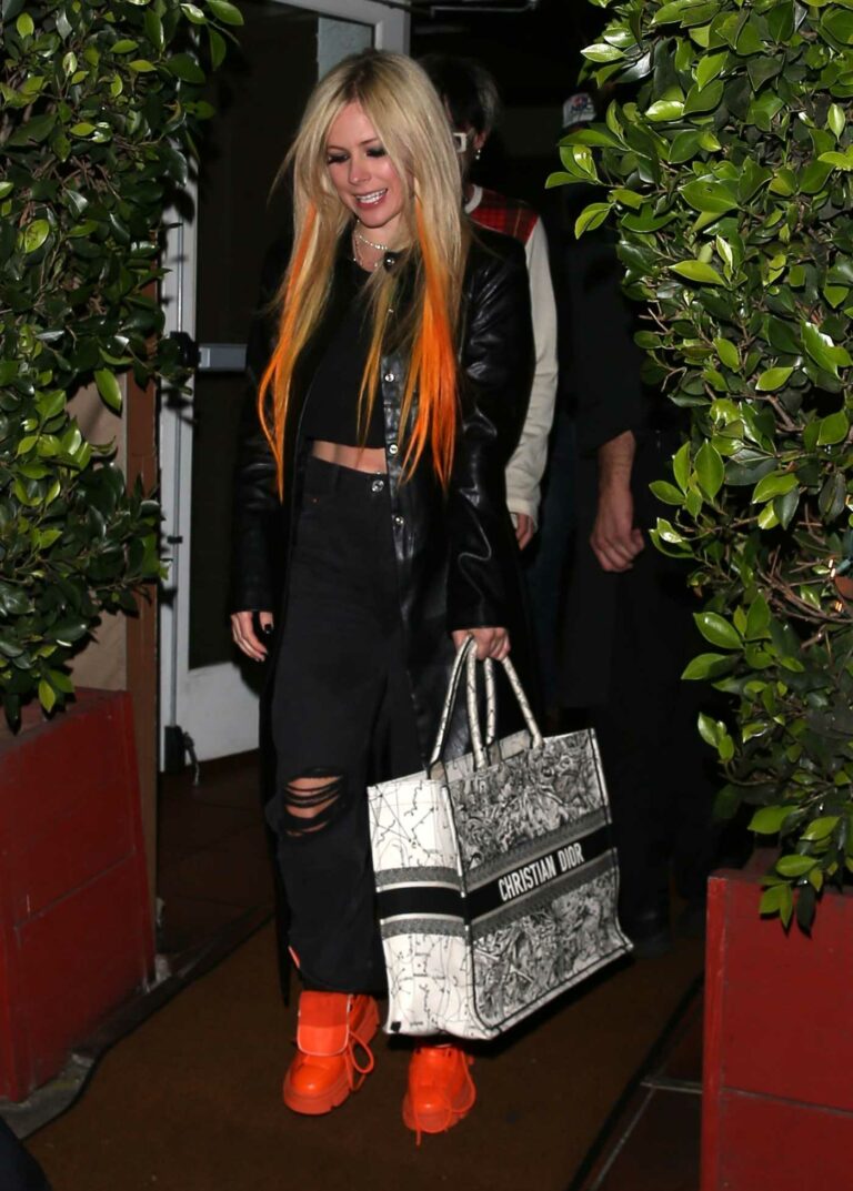 Avril Lavigne in a Black Leather Coat