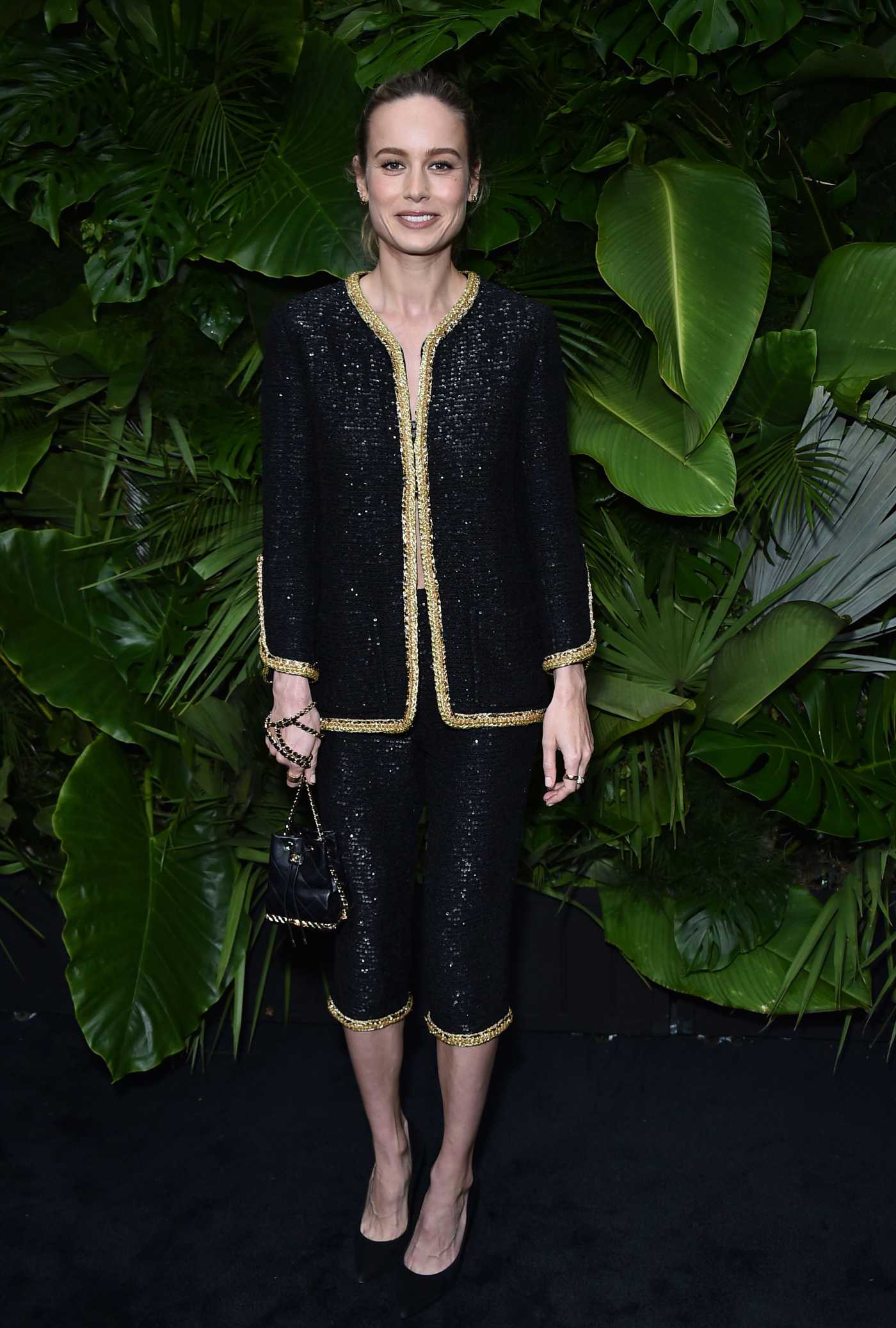 Brie Larson Attends the Chanel and Charles Finch Pre-Oscar Awards Dinner at the Polo Lounge in Beverly Hills 03/26/2022
