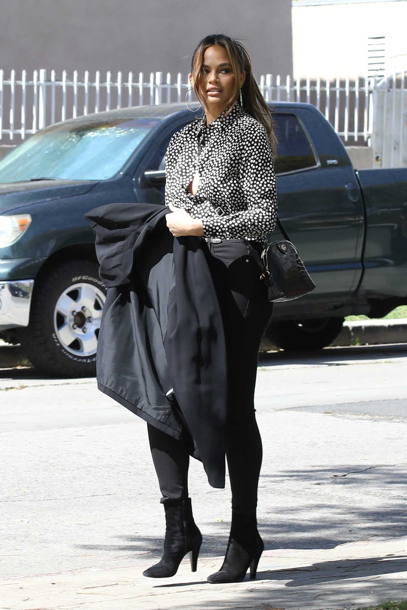 Chrissy Teigen in a Polka Dot Blouse Was Seen Out in Beverly Hills 03/05/2022