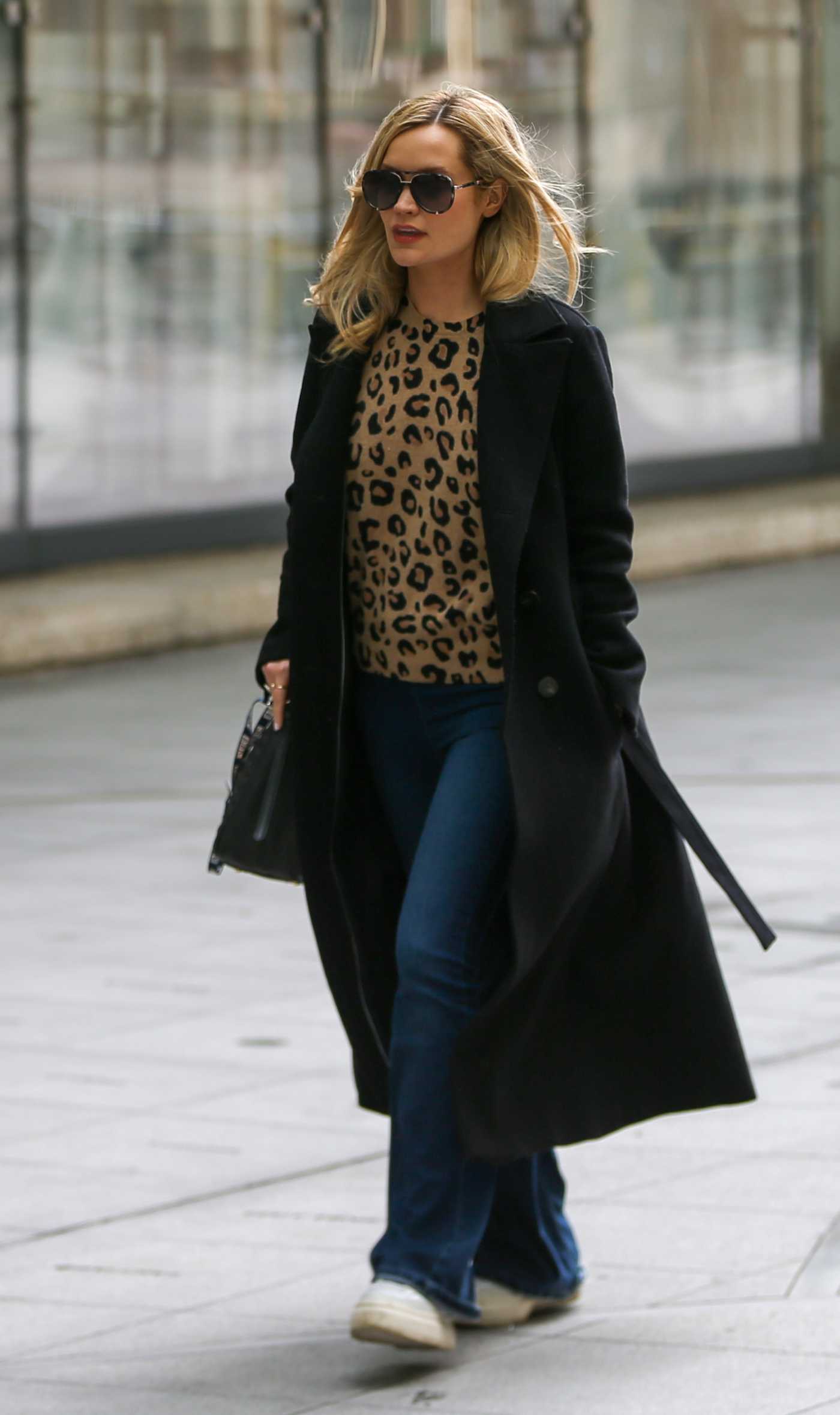 Laura Whitmore in a Black Coat Leaves the BBC New Broadcasting House in London 03/13/2022