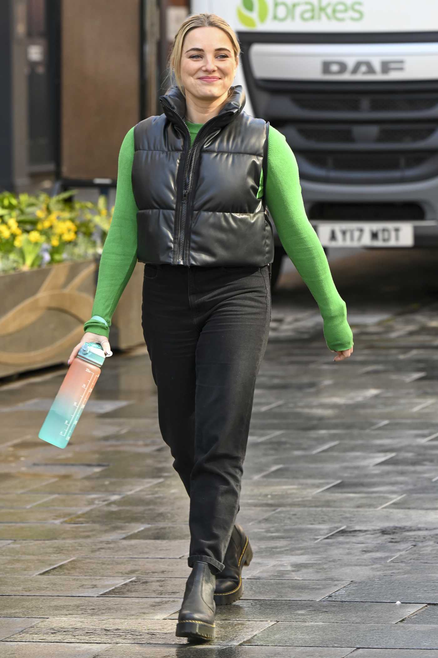 Sian Welby in a Green Sweatshirt Leaves the Global Studios in London 03/17/2022