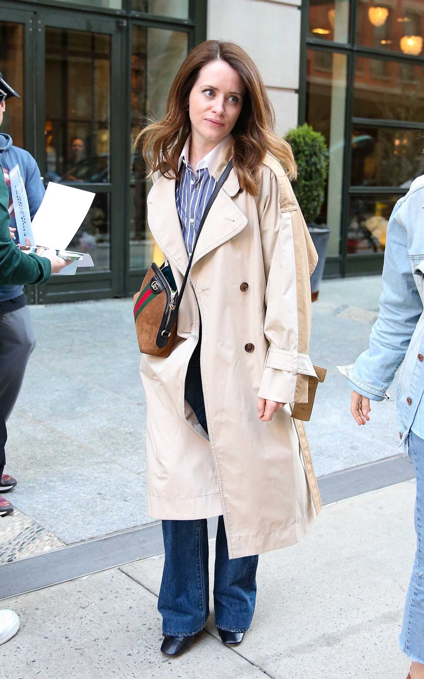 Claire Foy in a Beige Trench Coat Steps Out of the Crosby Street Hotel in New York 04/12/2022