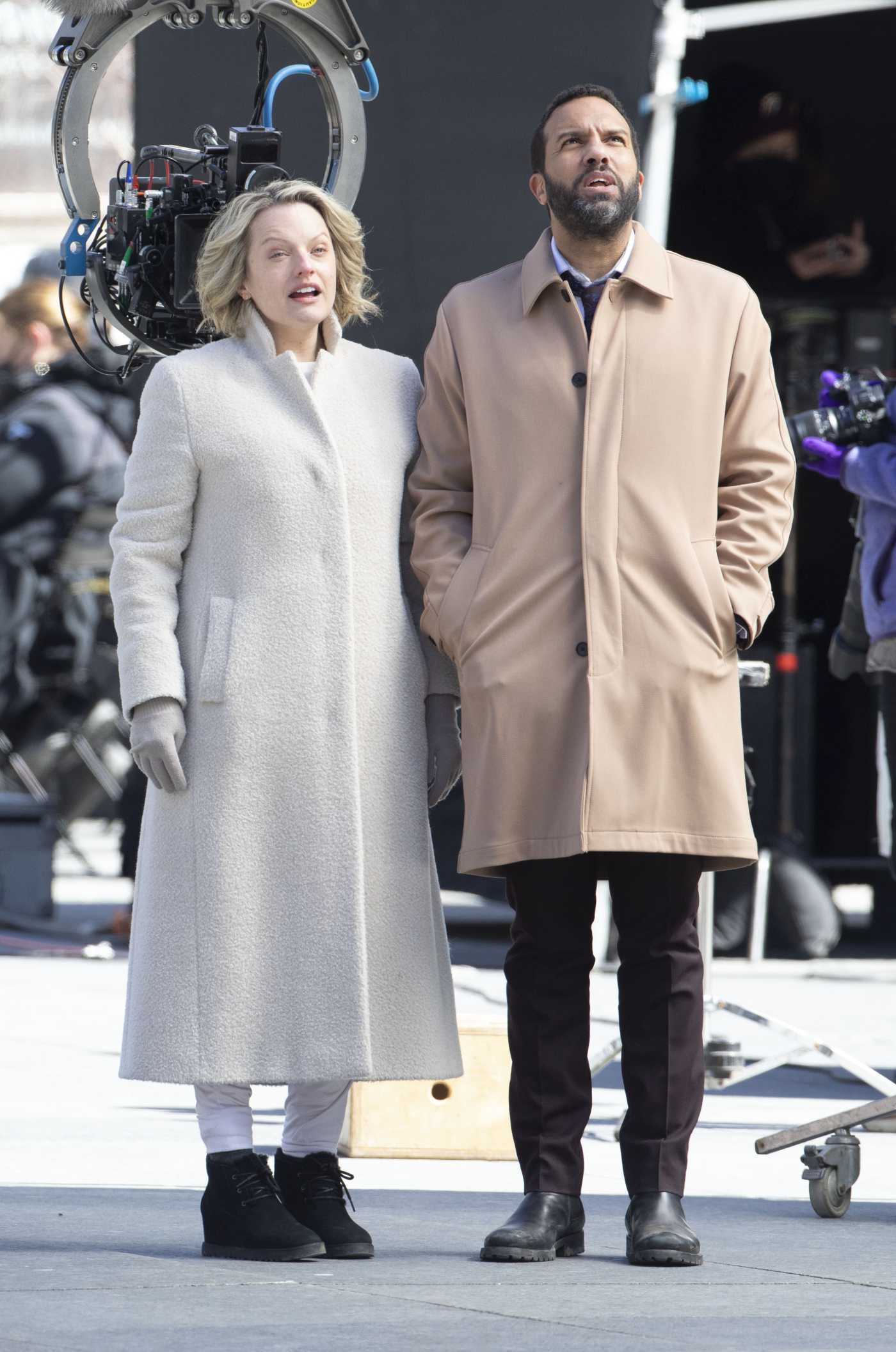 Elisabeth Moss in a White Coat on the Set of Handmaid's Tale with Co-Star O-T Fagbenle in Toronto 03/29/2022