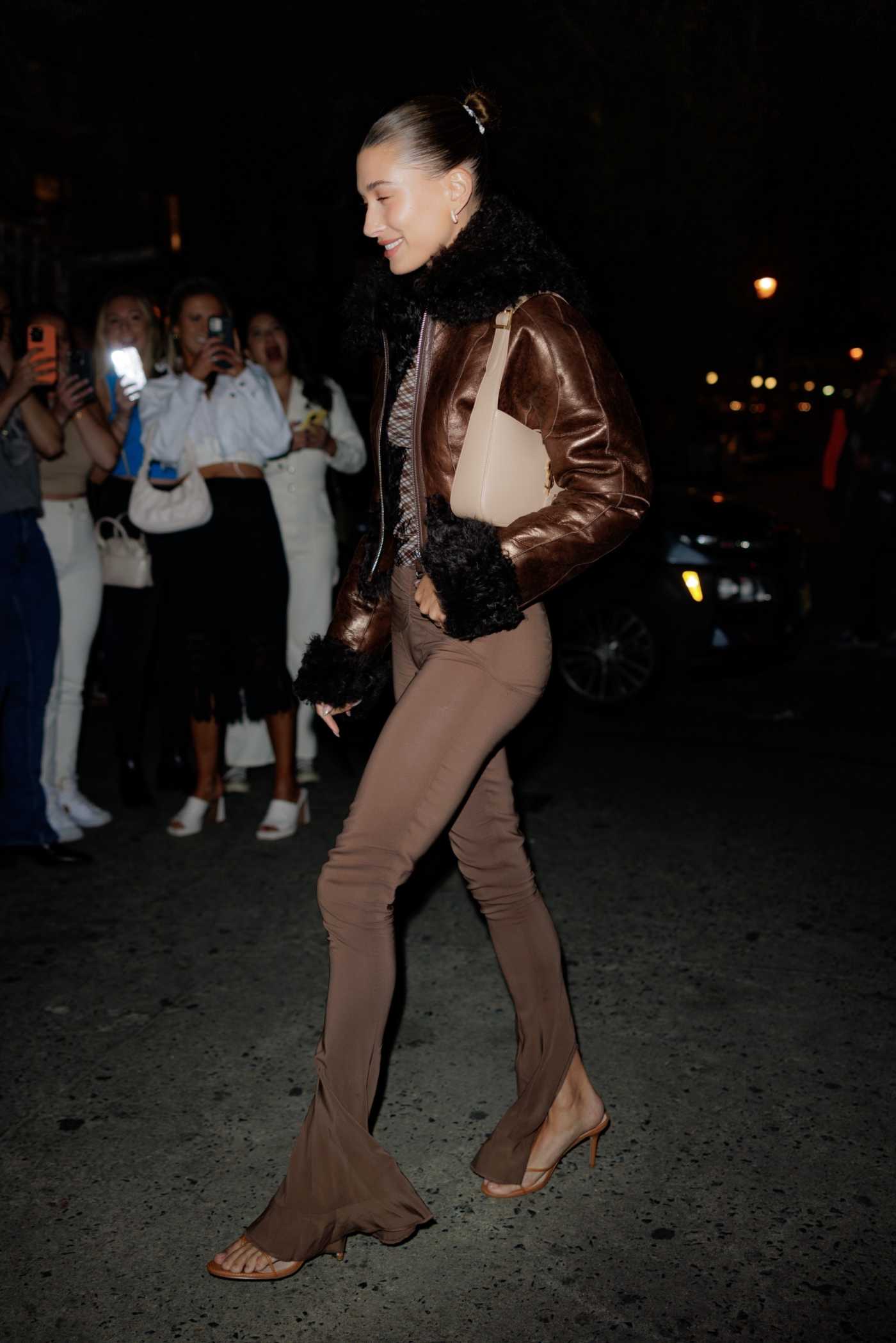Hailey Baldwin in a Brown Leather Jacket Arrives for Dinner at Lola Taverna in New York 04/30/2022