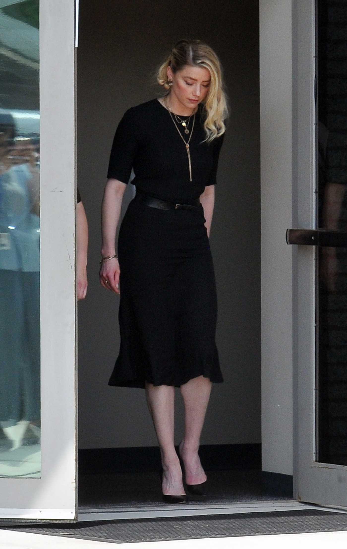 Amber Heard in a Black Dress Leaves Court with Her Sister Whitney in Fairfax 06/01/2022