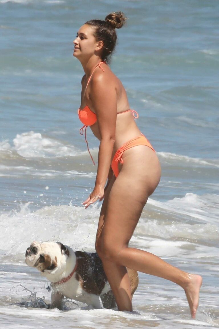 April Love Geary in an Orange Bikini