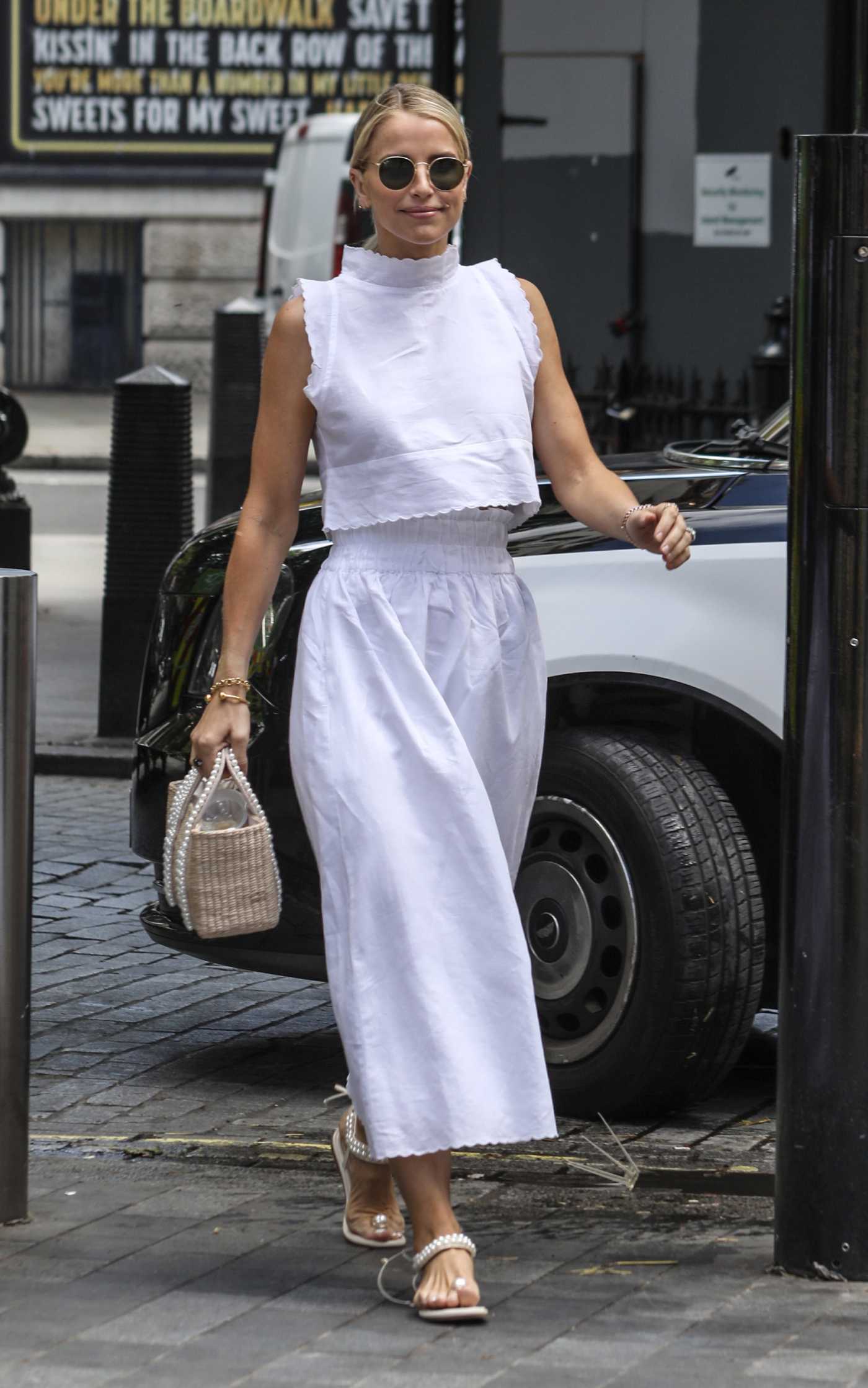 Vogue Williams in a White Ensemble Leaves the Global Radio in London 06/20/2022