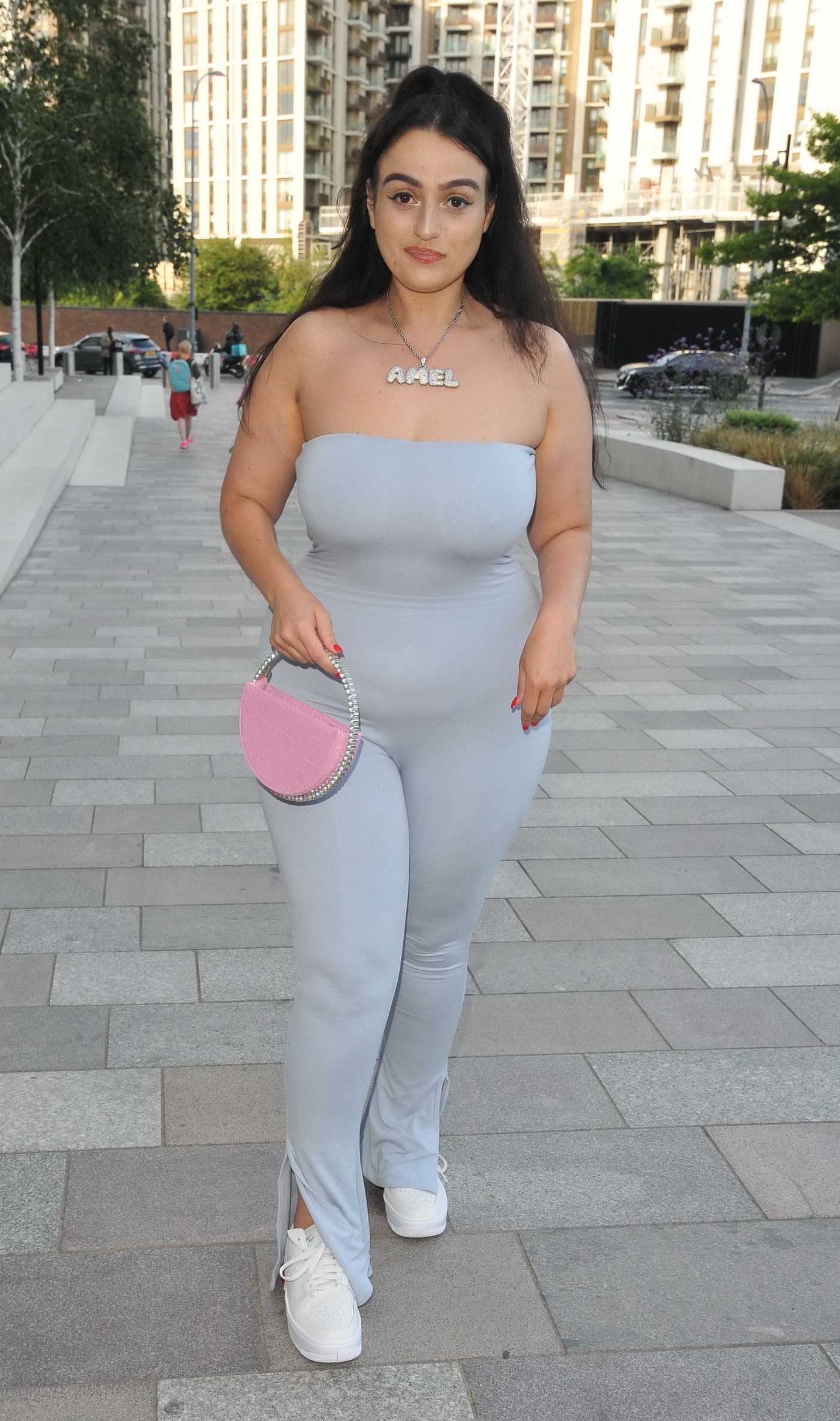 Amel Rachedi in a Grey Catsuit Arrives at Legends Never Die VIP Screening in London 06/29/2022