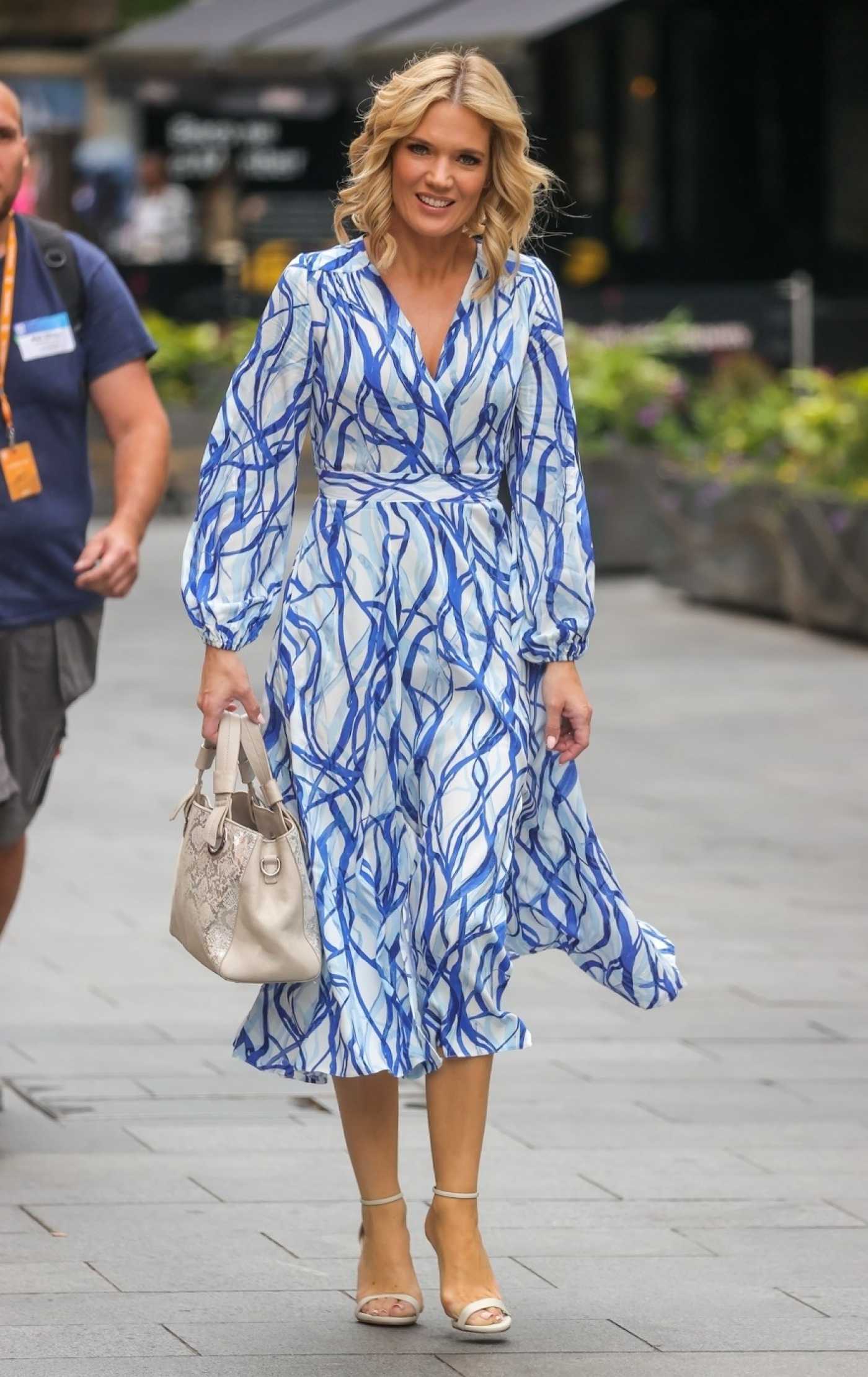 Charlotte Hawkins in a Blue Dress Arrives at the Global Radio in London 06/30/2022