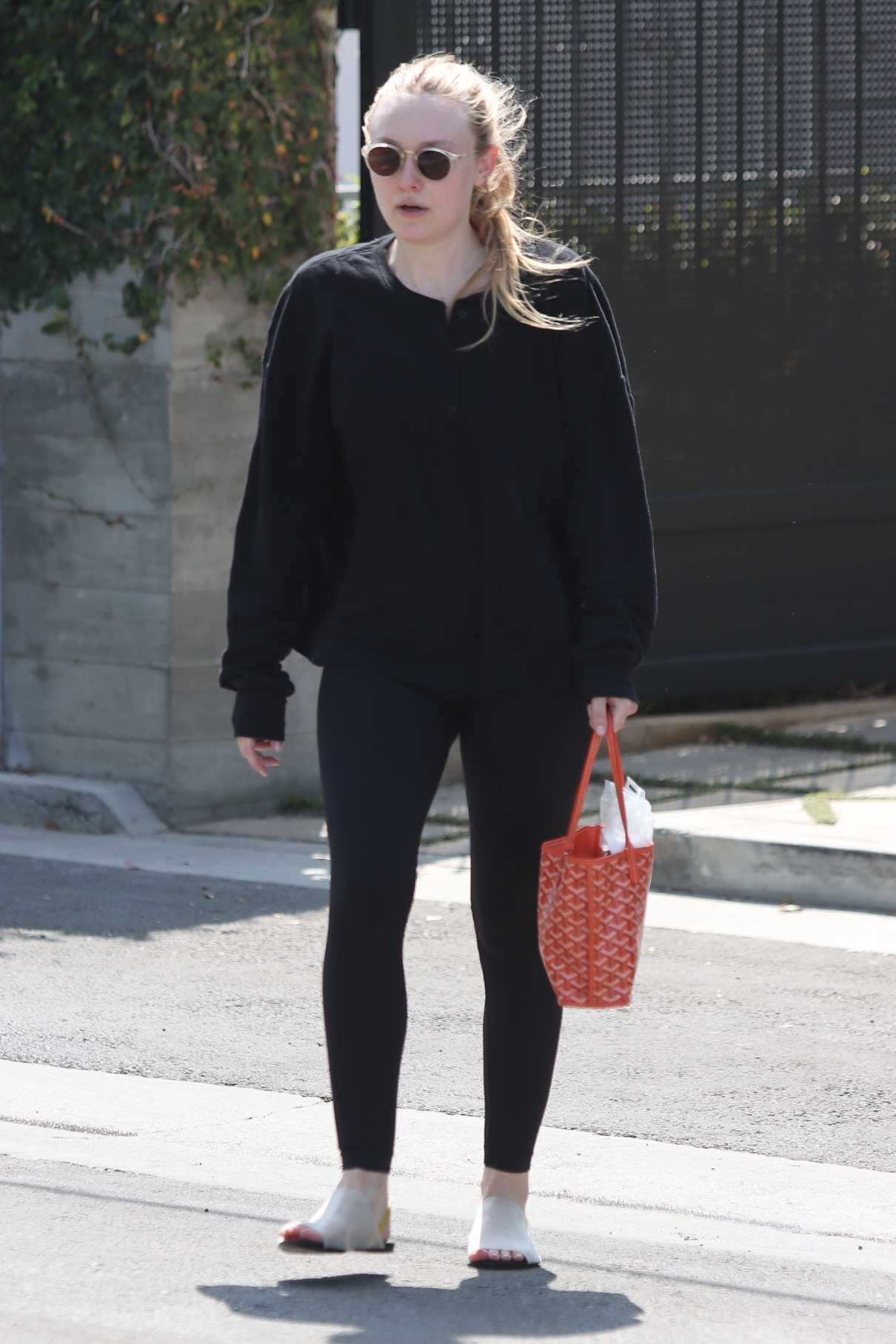 Dakota Fanning in a Black Outfit Leaves a Pilates Class in West Hollywood 07/25/2022