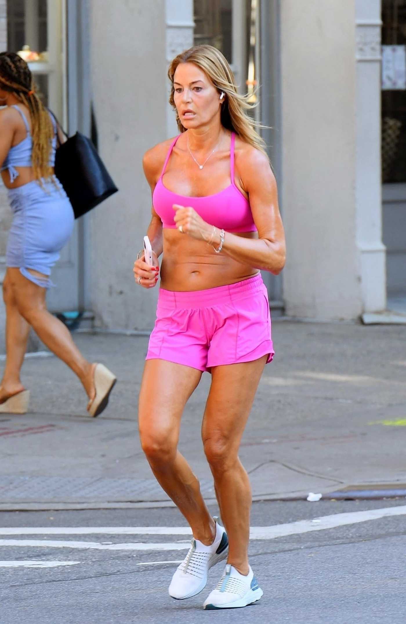 Kelly Bensimon in a Pink Sports Bra Takes a Morning Jog Around New York City 07/20/2022