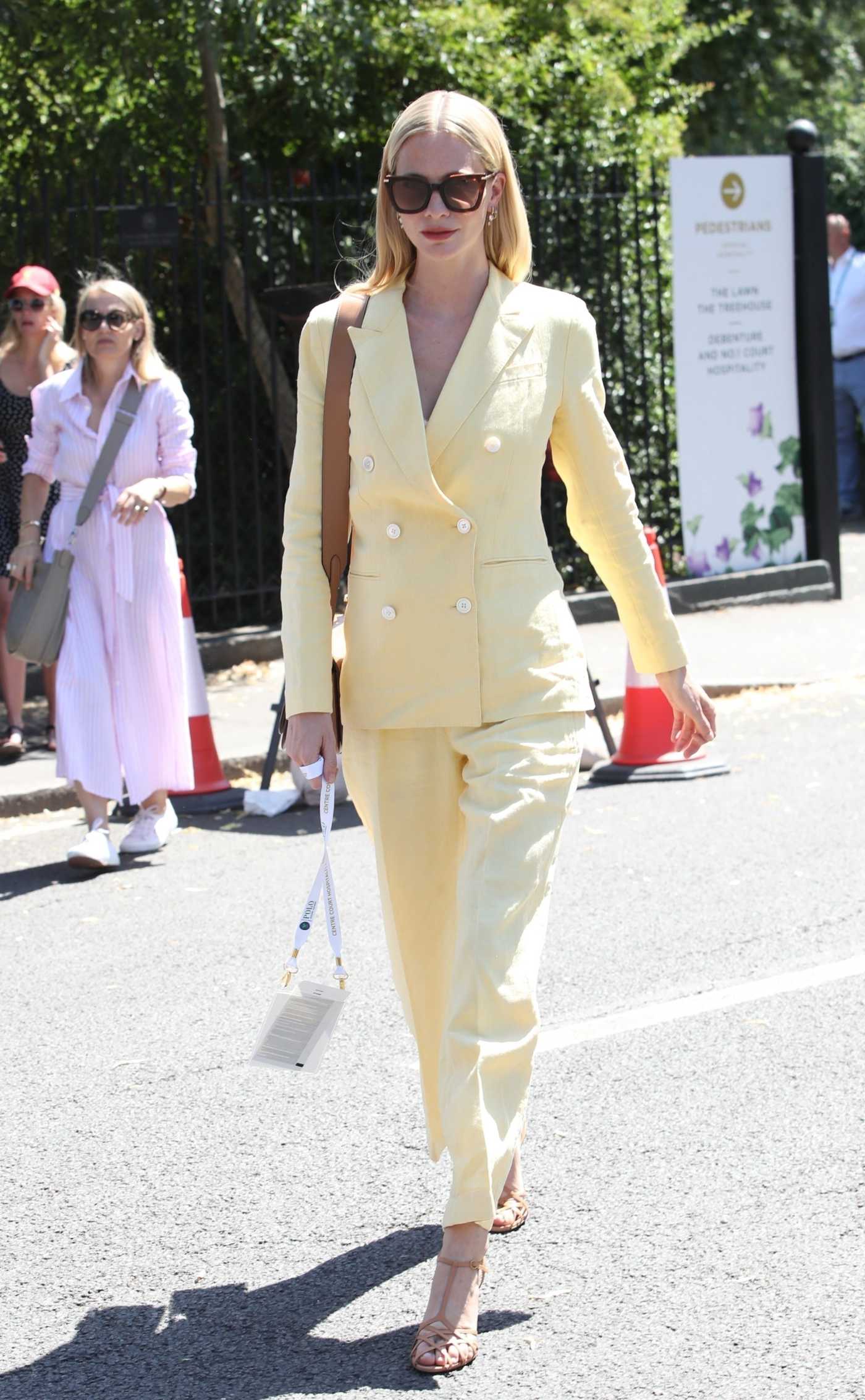 Poppy Delevingne in a Yellow Pantsuit Was Seen at Wimbledon in London 07/10/2022