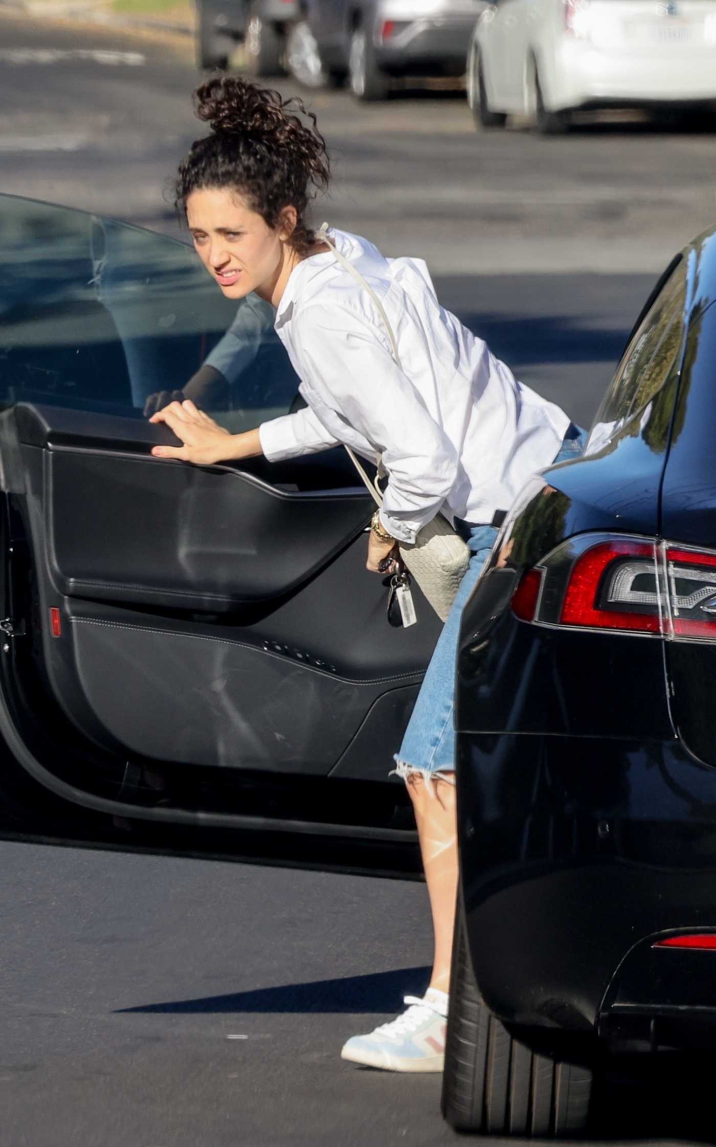 Emmy Rossum in a White Shirt Arrives at Friends for a Visit in Los Angeles 08/12/2022
