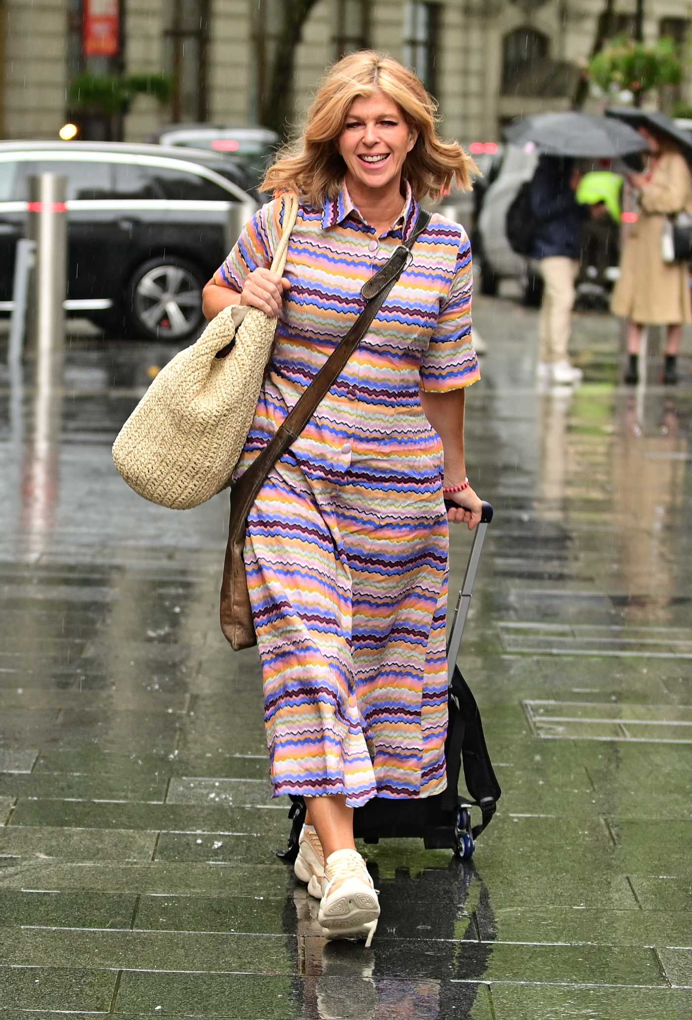 Kate Garraway in a Striped Dress Braves the Summer Rain as She Makes Her Way to the Global Radio in London 08/25/2022