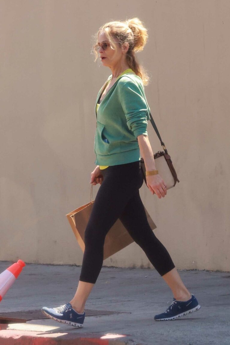 Kyra Sedgwick in a Green Hoodie