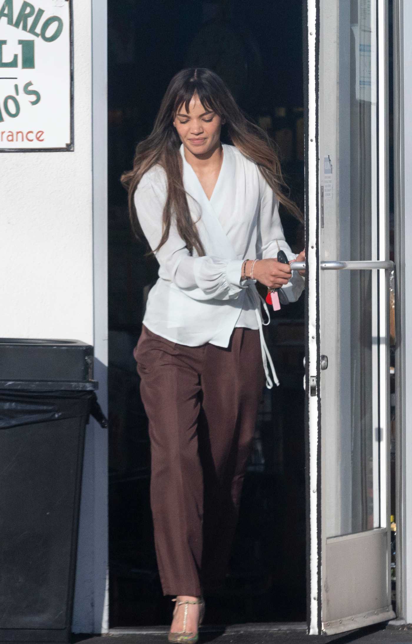 Leslie Grace in a White Blouse Leaves the Monte Carlo Italian Deli in Burbank 08/10/2022